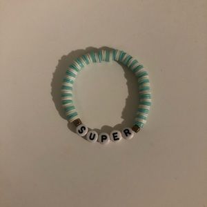 Teal and white “SUPER” clay bead braclett